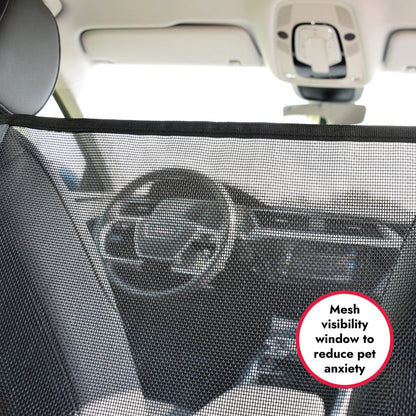 Car interior with a mesh visibility window for pets, showing steering wheel and dashboard.