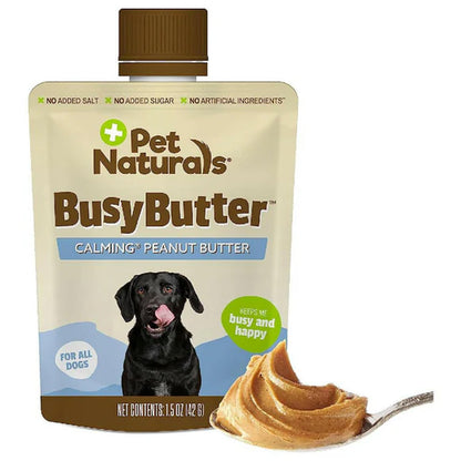 Pet Naturals Busy Butter calming peanut butter for dogs with a spoonful of peanut butter on a white background