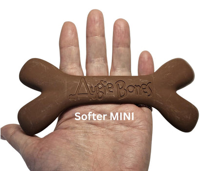 Brown dog toy shaped like a bone held in a hand, with 'Augie Bones' branding.