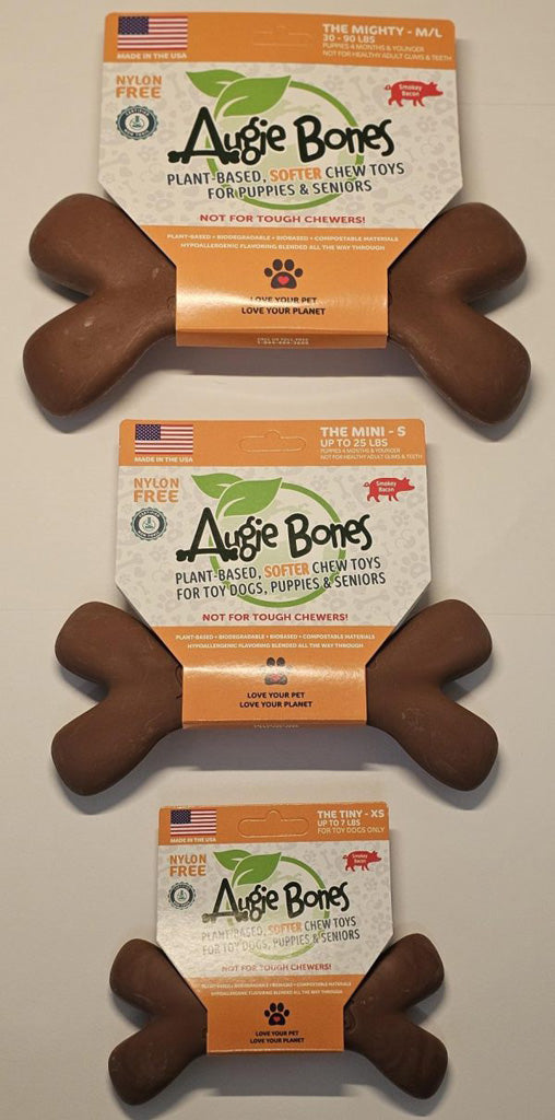 Three Augie Bones dog chew toys with packaging on a neutral background