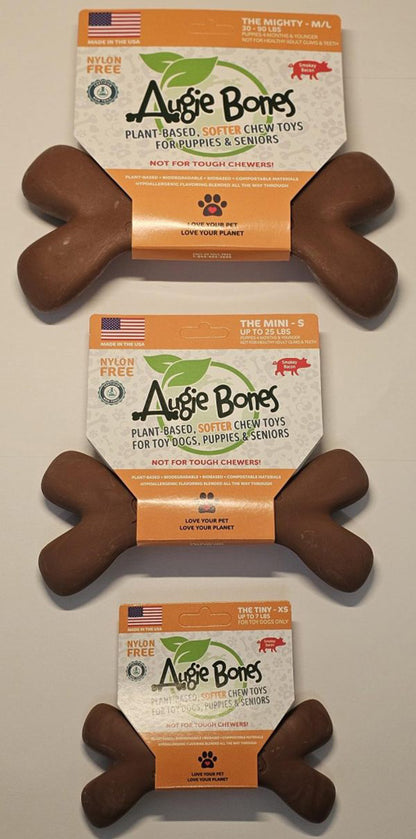 Three Augie Bones dog chew toys with packaging on a neutral background